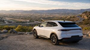 Electric vehicle overlooking varied roads and terrain that affect driving range